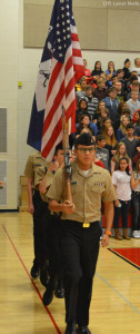 Dominick Nordin heads the NJROTC colorguard as they march out for the playing of the National Anthem.