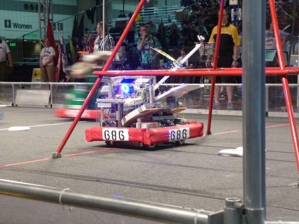 Udder Greatness, the teams robot, lines up to fire its frisbees.