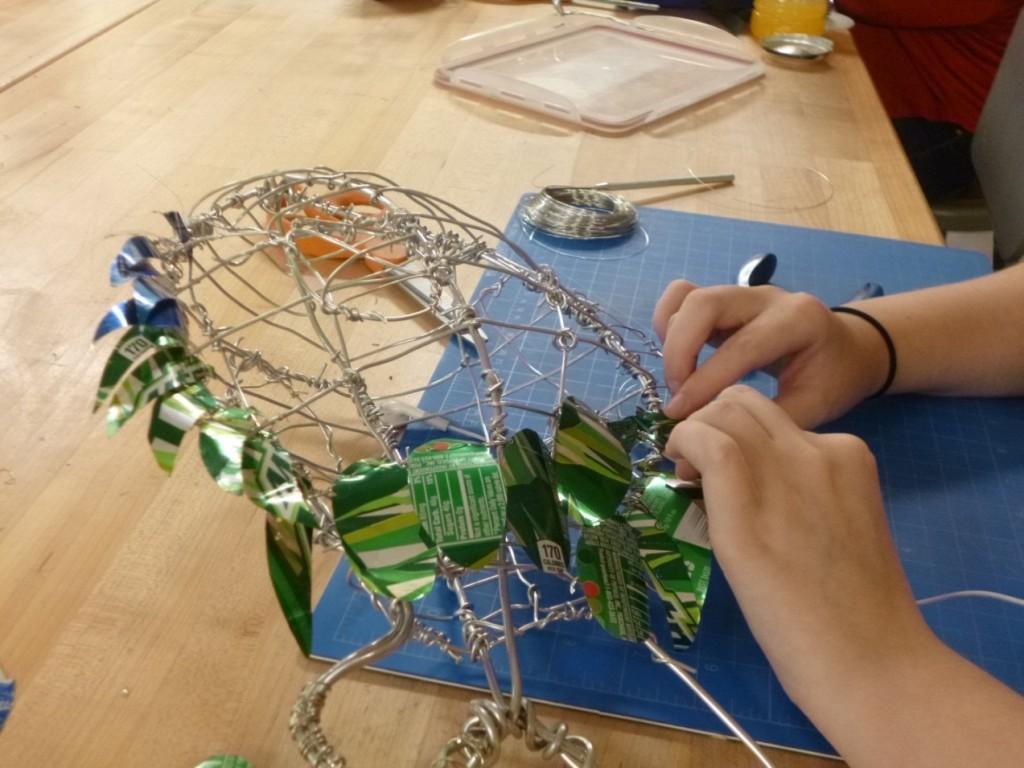 Mariah Wilson, 11th grade, creates bird sculptures out of wire and soda cans.

Photo Courtesy of Rachel Cleveland, 12th grade.