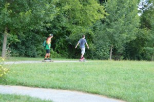 Junior Kobi Azoulay (left) and Sophomore Justin Mitchell (right) longboard down a hill