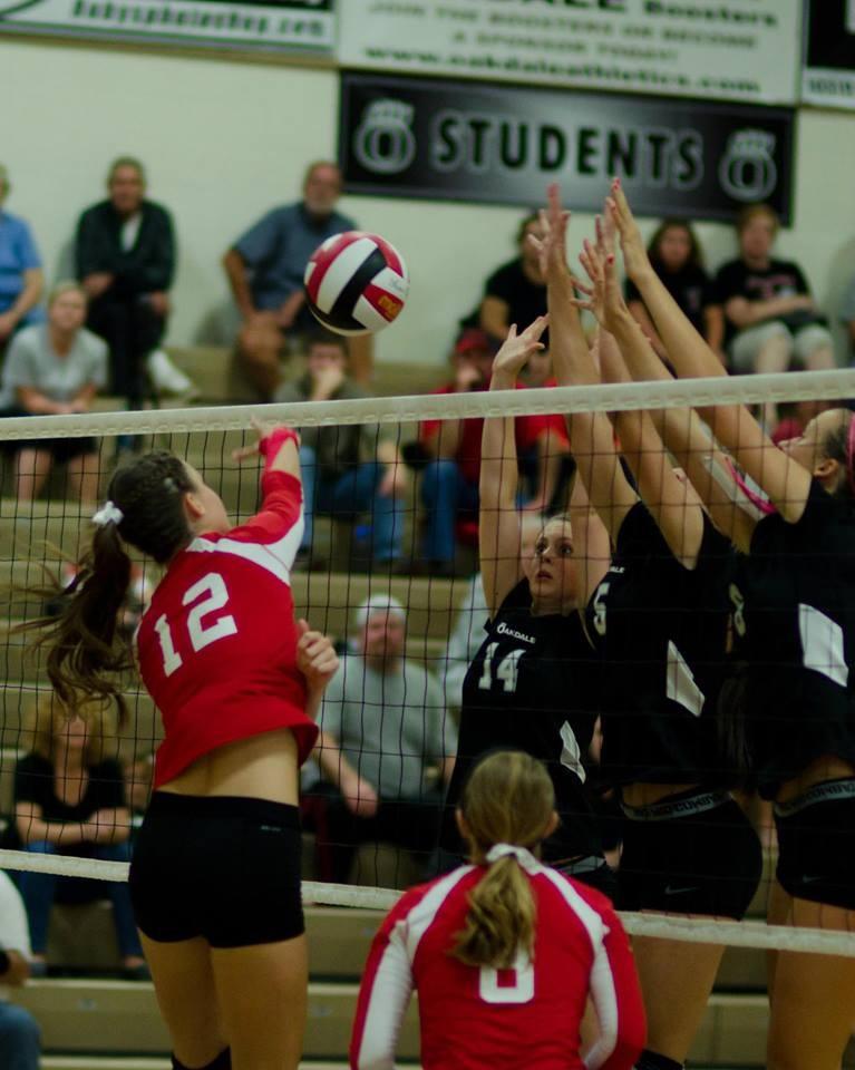 Senior Karin Shleimer sets senior Taylor Lohneis for a kill at the Linganore vs. Oakdale game on Thursday, September 19th. Lancers won in four games with winning scores of 25-22, 25-17, and 25-17.