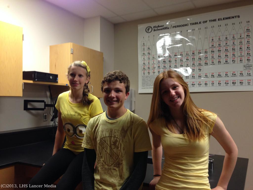 Sophomores Cassie Wheeles, Christian Thompson, and Marissa Maize show school spirit by wearing their class color, yellow.