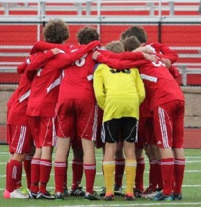The boys varsity soccer team huddles up. Courtes of Linganore sports boosters.