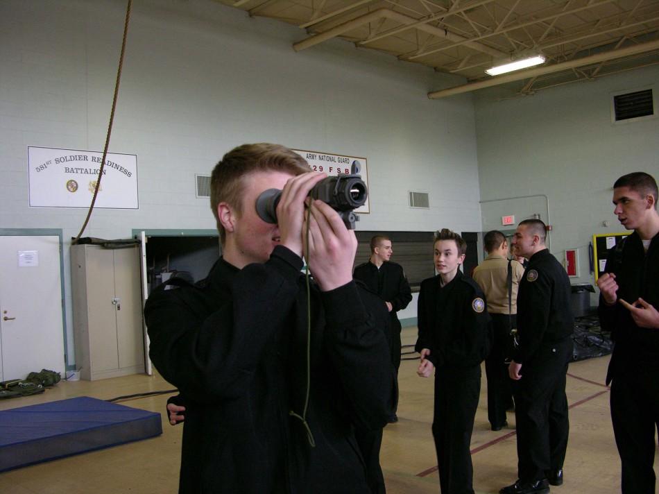 Andrew Longo Looking through a sight.
