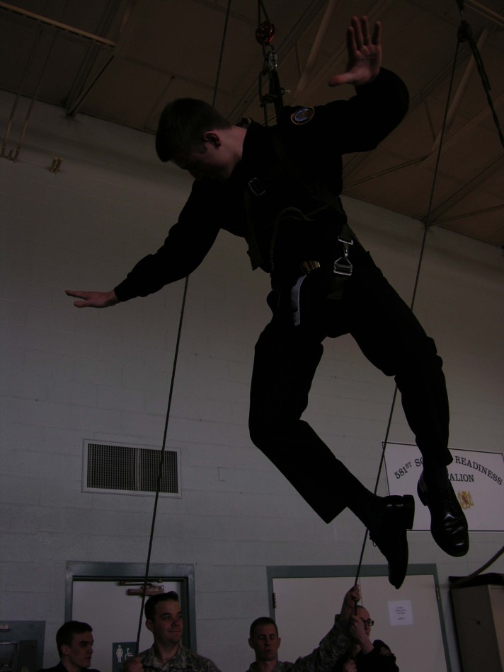 Brady Brockdorff being hooked in to simulate being lifted by a helicopter