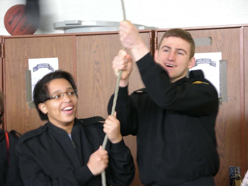 Brady Brockdorff and Carissa Gregory lifting students up.