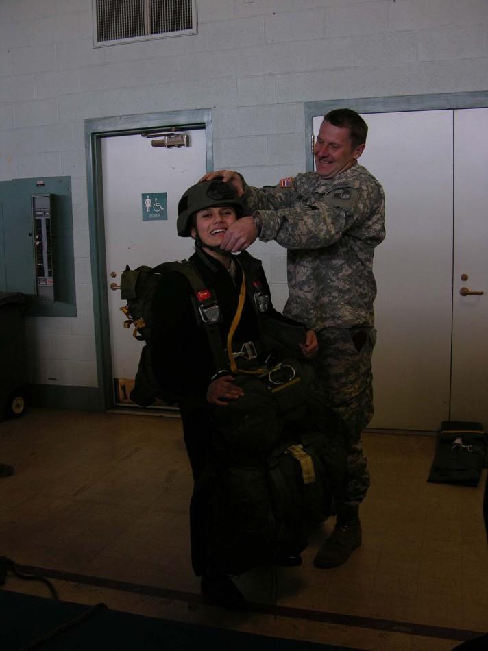 Haley Beltran equipped with over 100lbs of parachute harnesses and equipment 