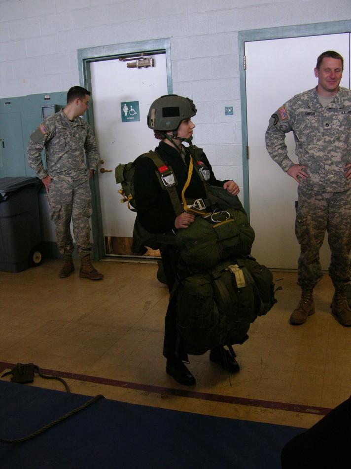 Haley Beltran equipped with over 100lbs of parachute harnesses and equipment 