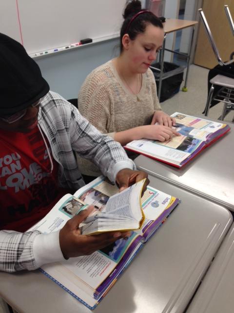 Students Catharine Dietrich (right) and Kywri Shakir (left) work on translating a text from their Spanish textbooks