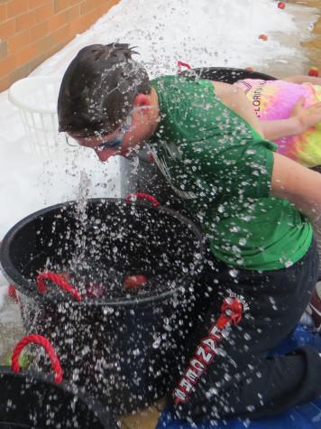 Chase LaPilusa shakes water off his head during apple bobbing.