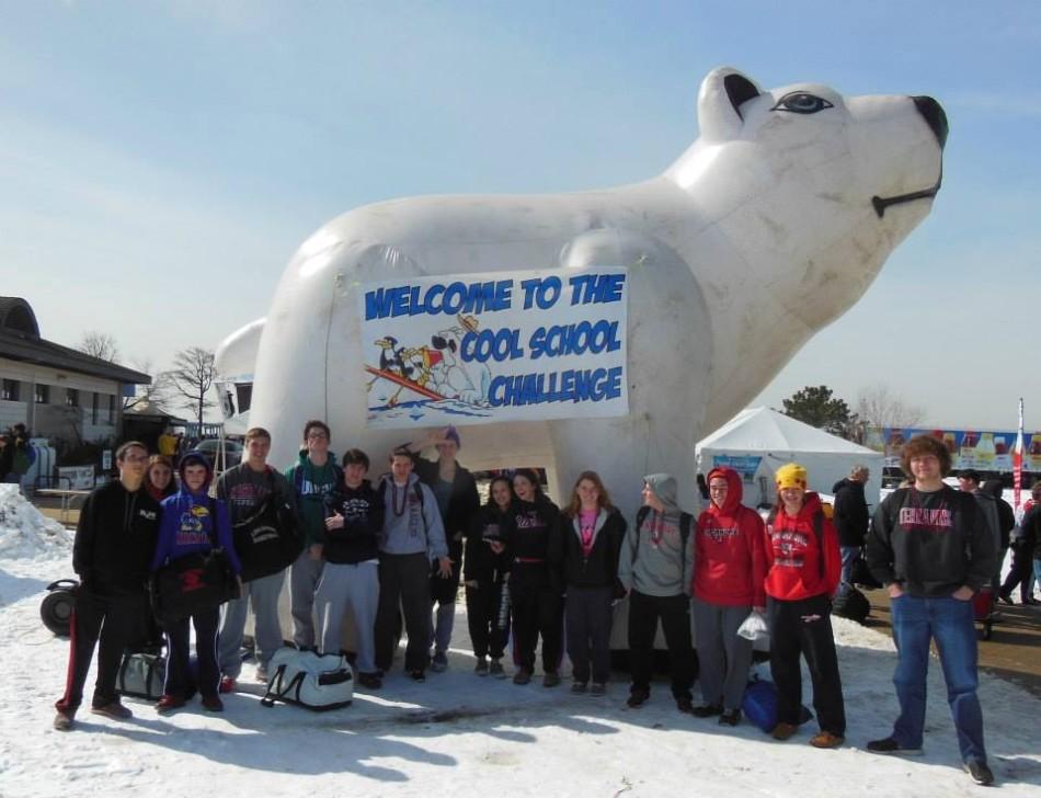 Student participants from Linganore High School stand in front of welcome sign at the site of the Polar Bear Plunge