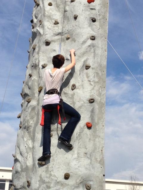 Sophomore Kristina Baskin climbs the rock wall.