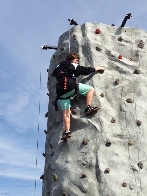 Katie George climbs the rock wall. 