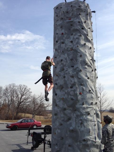 Sophomore Tyler Weiseckel climbs the rock wall.