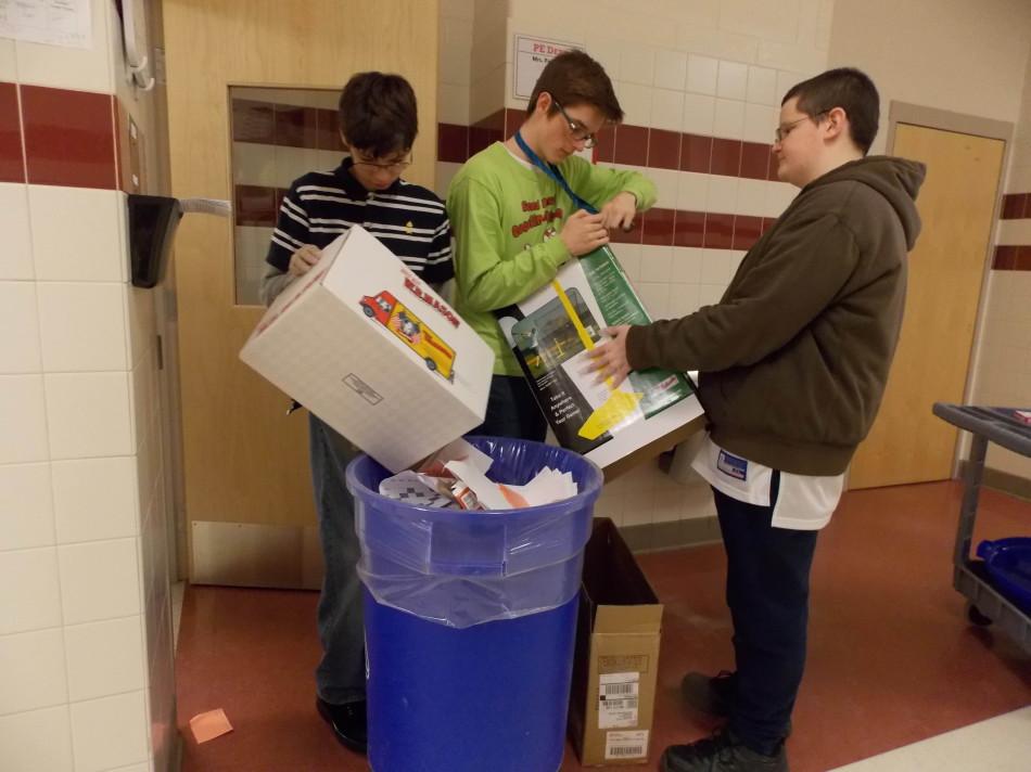 Owen Gamba, Jakob Connelly, and Mike Wilkerson collect recycling.