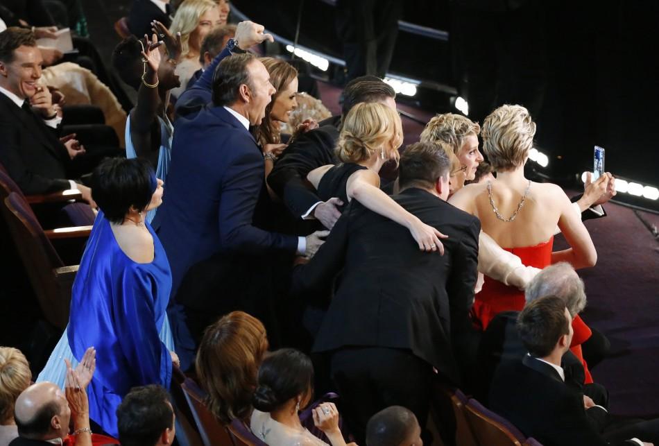 Ellen DeGeneres takes a selfie with attendees during the 86th annual Academy Awards on Sunday, March 2, 2014, at the Dolby Theatre at Hollywood & Highland Center in Los Angeles. (Robert Gauthier/Los Angeles Times/MCT)