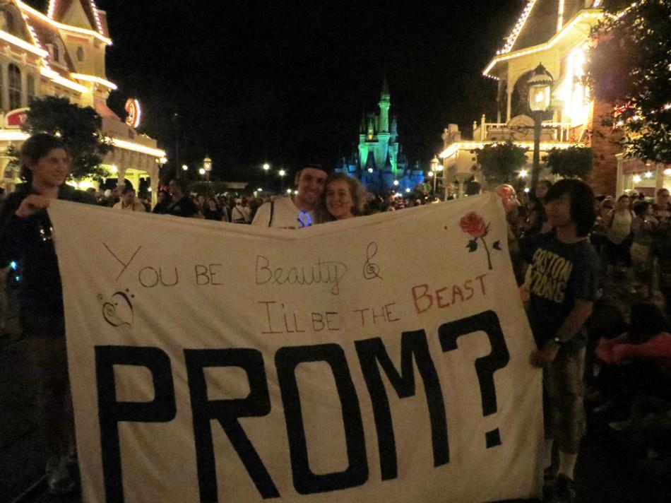 Joe+Dirndorfer+promposed+to+Abi+Bladen+with+a+large+sign+during+fireworks+in+the+Magic+Kingdom+in+Walt+Disney+World