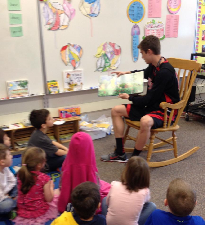 Senior Ryan Schmidt reads to elementary schoolers