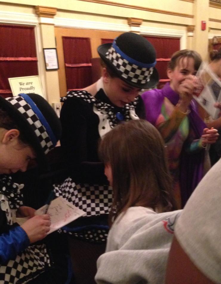 Isabella Marcellino signs autographs after performing in Dance Unlimited and Other Voices production of Alice in Wonderland on April 18 at the Weinberg Center.