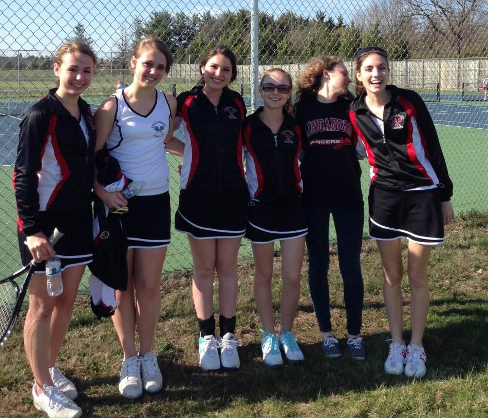 The girls first singles, second singles, first doubles and second doubles pose for a picture after playing Tuscarora. 
