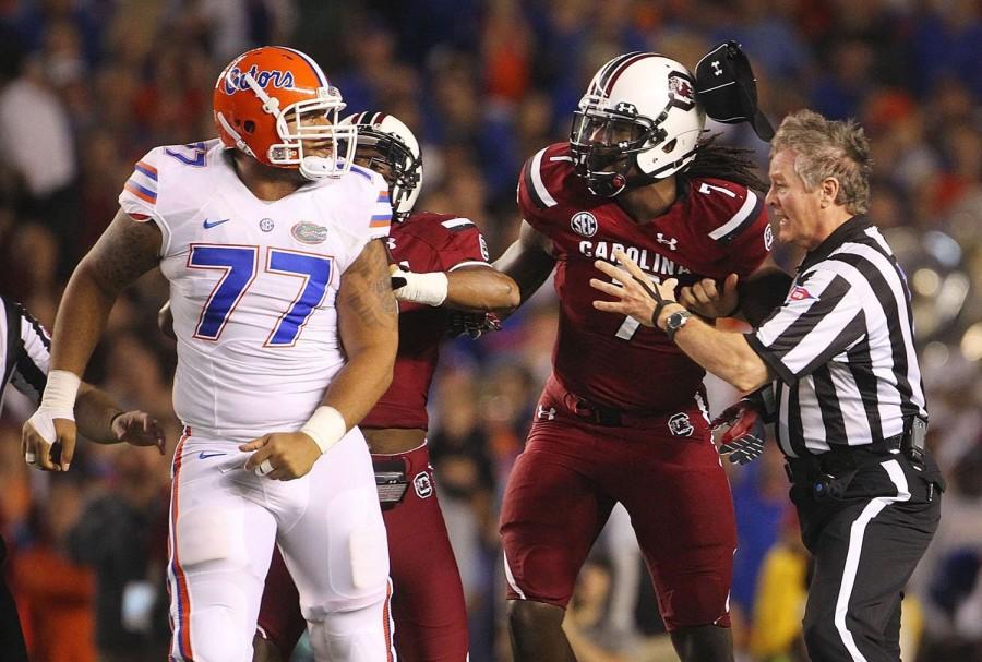 Jadeveon Clowney (7) of the South Carolina Gamecocks and Ian Silberman (77) of the Florida Gators exchange words after a play during the first half at Williams-Brice Stadium in Columbia, S.C., on Saturday, Nov. 16, 2013. (Kim Kim Foster-Tobin/The State/MCT)
