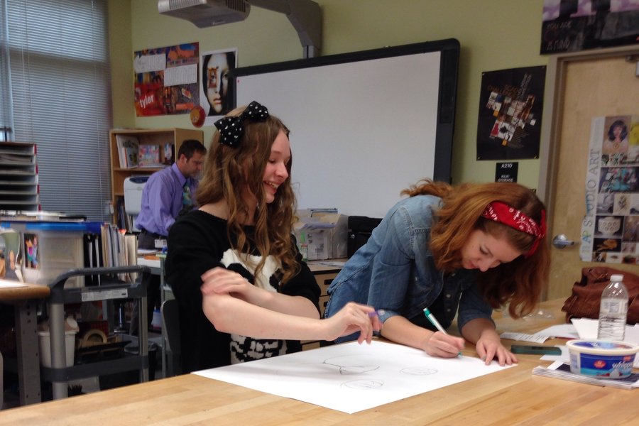 Ashley and Liz Moore work together on an AP art collaboration. 