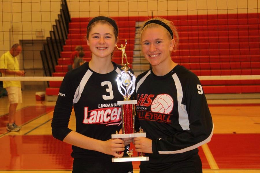 Varsity captains, Abbey Graham and Rebecca Downs hold the teams second place trophy. 