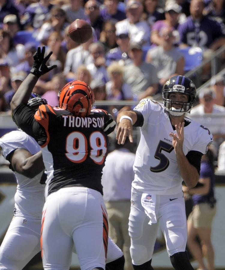 Cincinnati Bengals defensive tackle Brandon Thompson (98) reaches up as Baltimore Ravens quarterback Joe Flacco (5) throws an incompletion during the first quarter on Sunday, Sept. 7, 2014, at M&T Bank Stadium in Baltimore. (Karl Merton Ferron/Baltimore Sun/MCT)