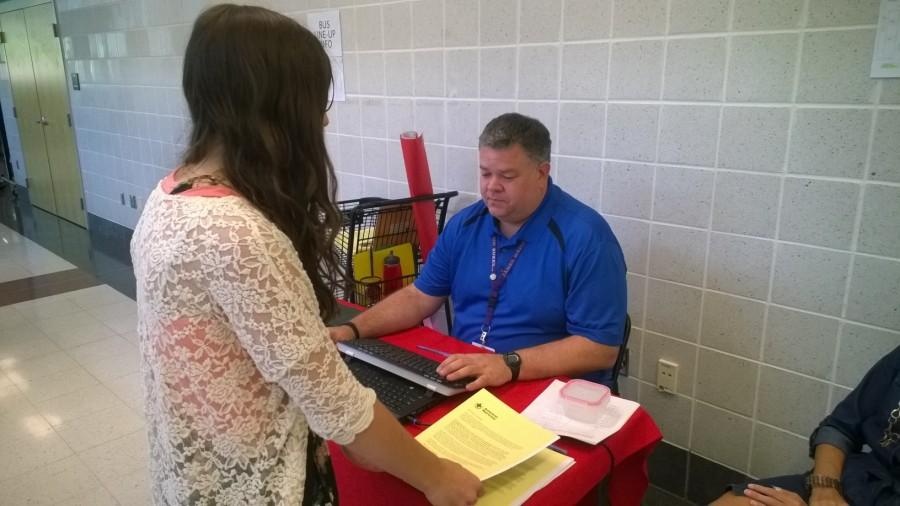 Photo of the Day 10/7/14: Sophomore Cassie Harris asks about blood drive information