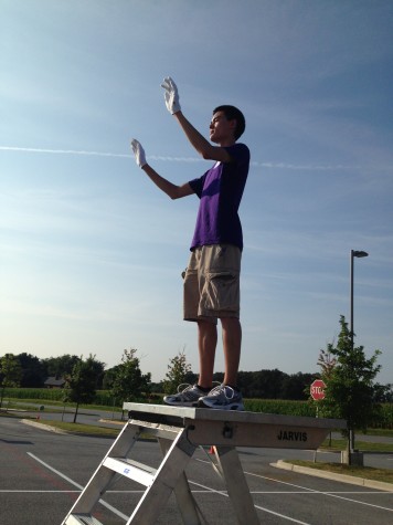 Noah conducts the marching band during summer band camp 2014.