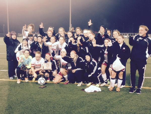 The varsity girls' soccer team poses after their last game of the season on 11/13/2014. 