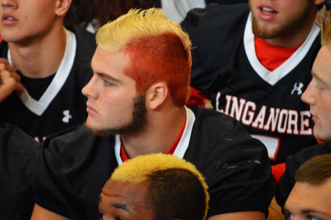 Senior Derek Wilson watches the pep rally. 