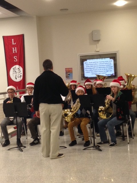 The Brass Ensemble plays holiday music to spread Christmas spirit through the school halls in the morning on Monday and Tuesday before winter break. 