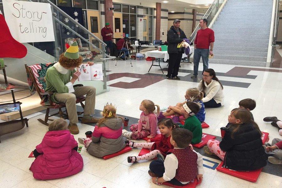 Junior Kylan Connolly dressed up like an elf to read to children at Lancer Candy Lane. 