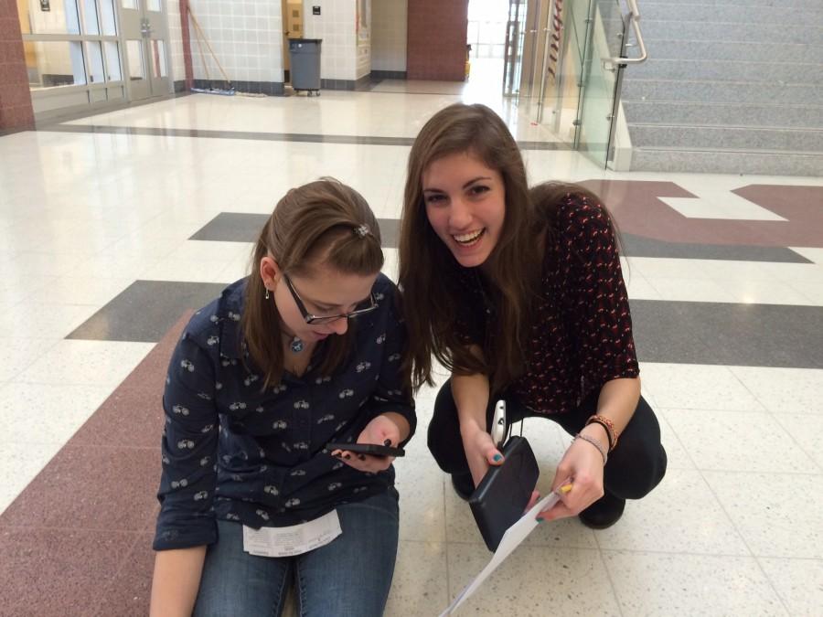 Madeline Wodaski and Rhiannon Wiland work together to solve a clue.