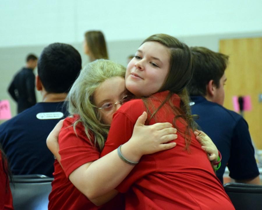 Sarah Webber (left) and Gabby Wolfe (right) share a hug after their tournament. 