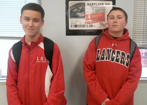 Freshmen Connor Starkie (Left) and Hunter Klien (Right) wear red to support the Lancers basketball team