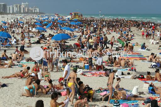 The beaches in southern Florida are packed with people on their spring break.