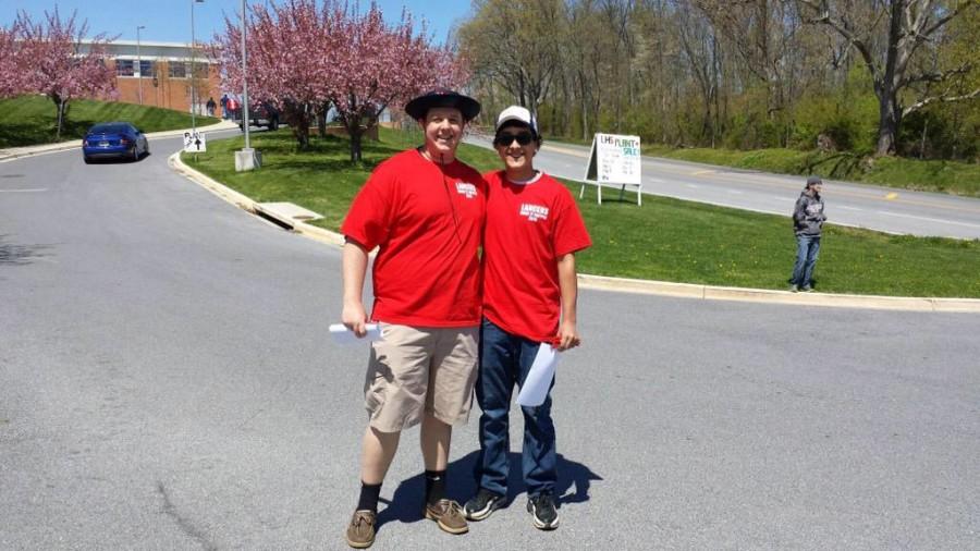 Seniors Chaz Atchison and Mike Fink checking people in.