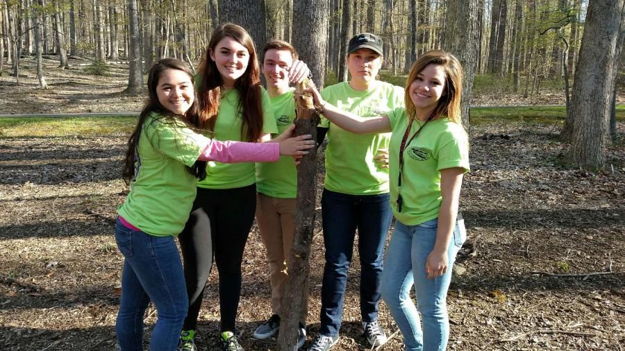 AP Environmental students (from left to right) Michelle Reina, Sara Combs, Ryan Stark, Abby Hilton, and Olivia DuBro pose for a picture in the Cunningham Falls State Park forest.