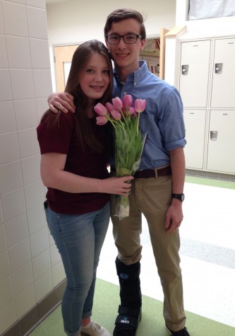 Alyssa Mattison poses with her prom date Brendan Mccann and her lovely tulips.