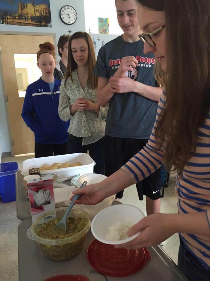 Miranda Timberlake, Sarah Hall, Tommy Moyer, and Michelle Carter enjoy cultural dishes