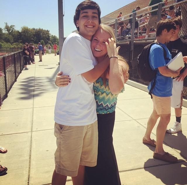 Chaz Atchison hugs his friend Mckenzie Mccaull at the picnic