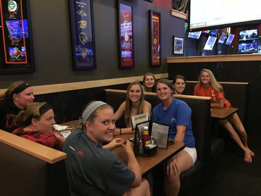 Members of the girls softball team gather at Buffalo Wild Wings fundraiser.