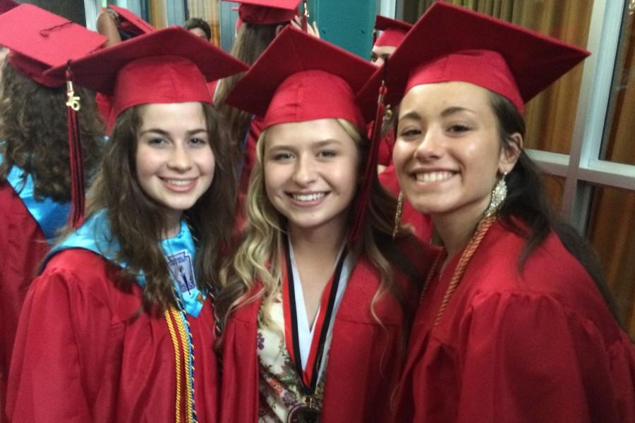 (Left to right) Elena Nicoll, Rebecca Hobbs and Michaela Loven take a picture before graduation. 