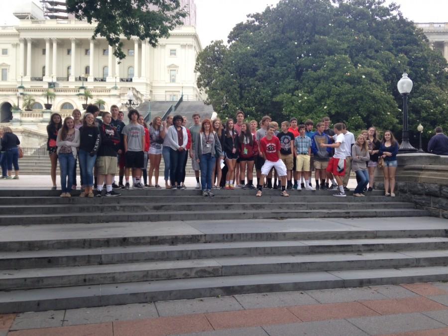Jamie Hendis Government and AP Political Science classes pose by the steps in front of the Capitol Building.