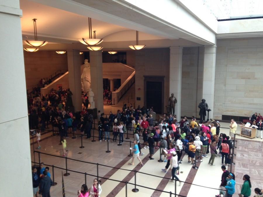 Tourists wait in line to view the inside of the Capitol Building.