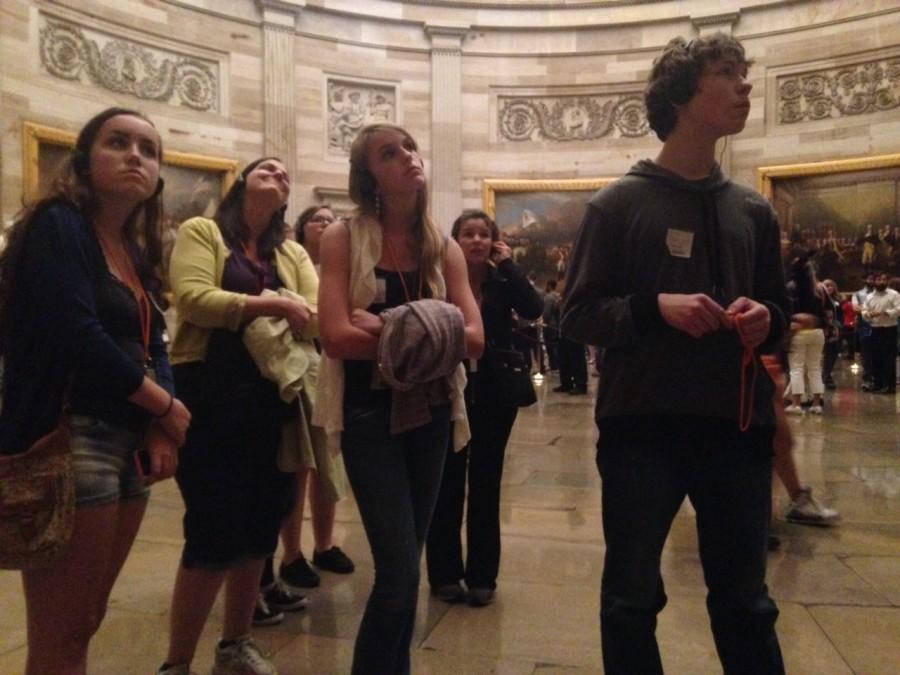 Government students listen through headphones as their tour guide informs them on the Rotundas history.
