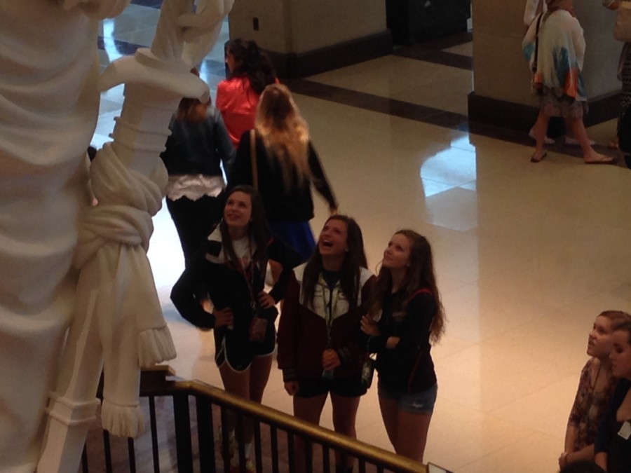 Students admire the statues in the Capitol Building Visitor Center.