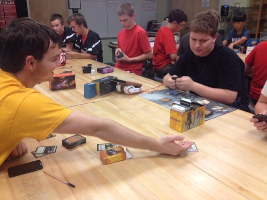 Alex Pare and Matthew Titus enjoy a game of Magic during the September club day.